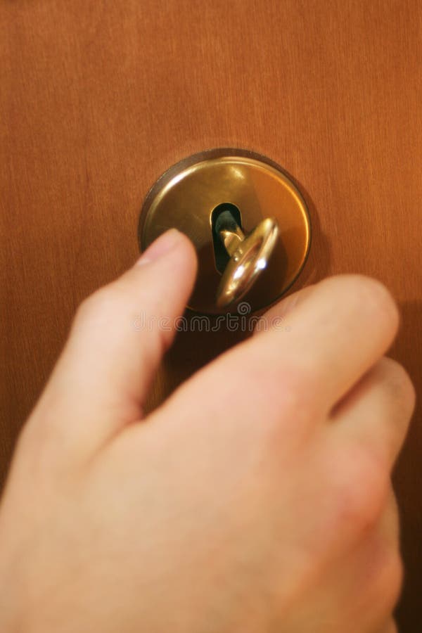 Hand and key royalty free stock photo
