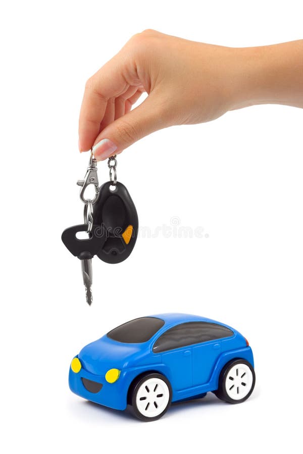 Hand with key and car