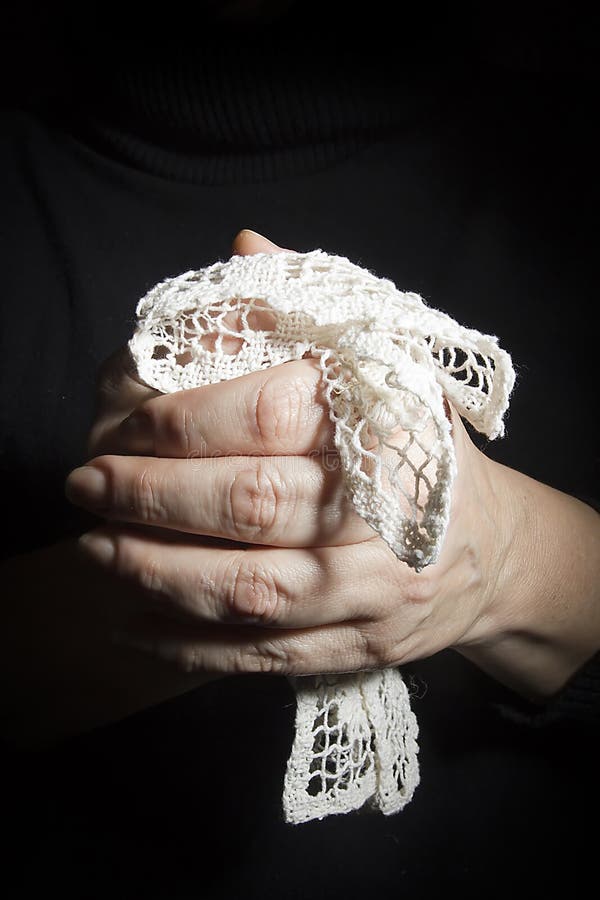 Hand with a lace scarf