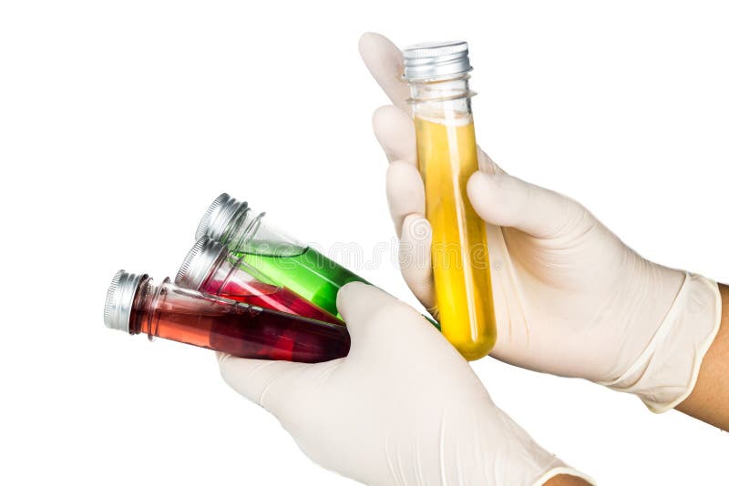 Hand in latex gloves holding test tubes with liquid. stock images Hand in latex gloves holding test tubes with liquid. stock images