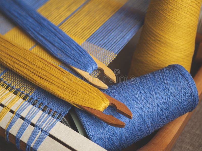 Hand Loom with Blue and Yellow Plain Weave, Two Shuttles and Yarn