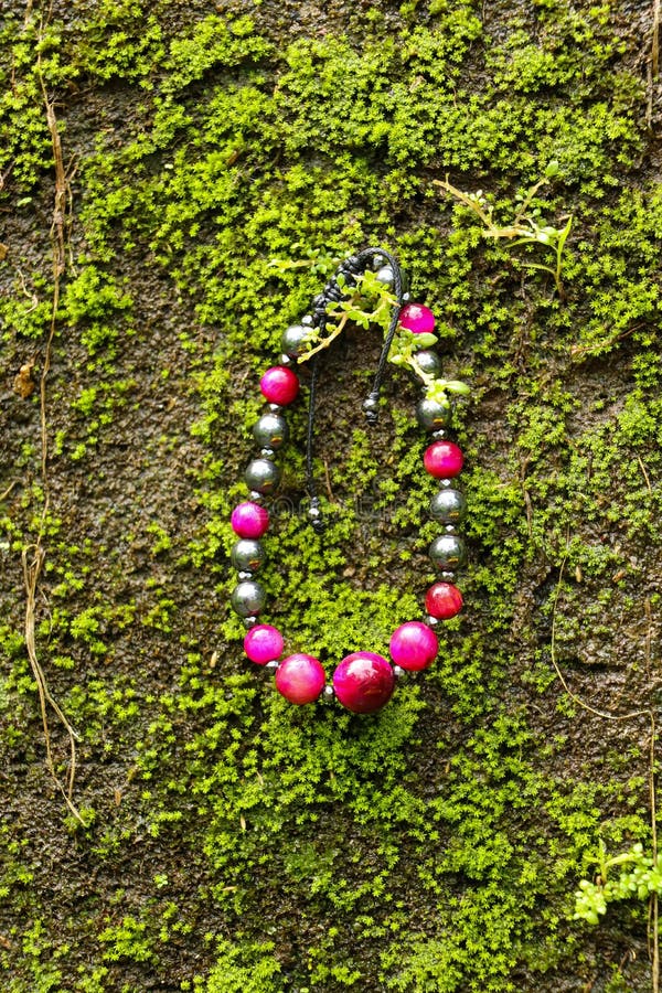 Hand Made Bracelet In The Outdoors With Moss Backround Stock Image