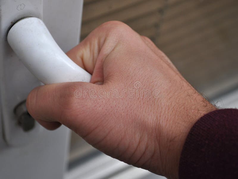 Hand reaching for doorknob stock image. Image of pale 12111801