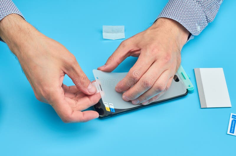 The Man Replacing the Broken Tempered Glass Screen Protector for
