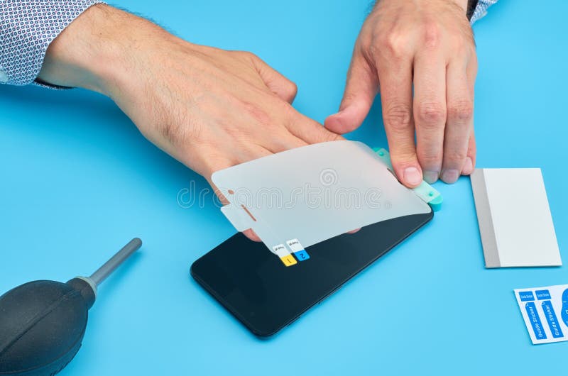 The Man Replacing the Broken Tempered Glass Screen Protector for