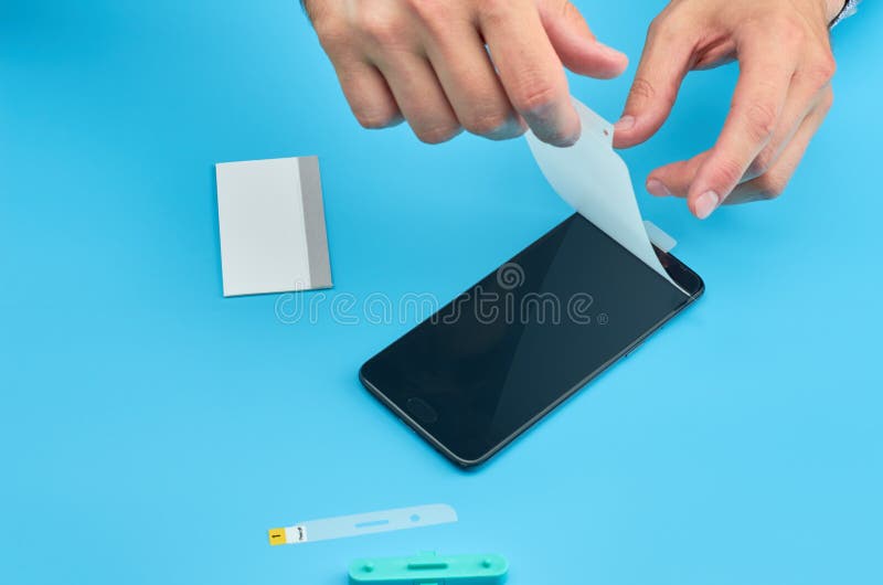 The Man Replacing the Broken Tempered Glass Screen Protector for