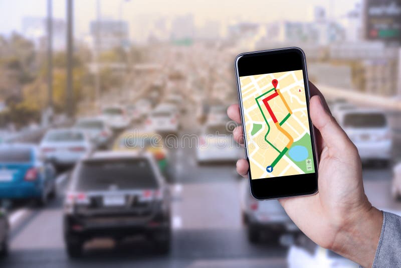 Hand of Man Using Map on Smartphone Application with Traffic Jam Stock