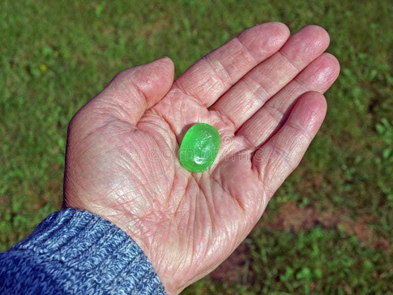 Hand with mint candy 2 stock photo. Image of green, mint 31874422
