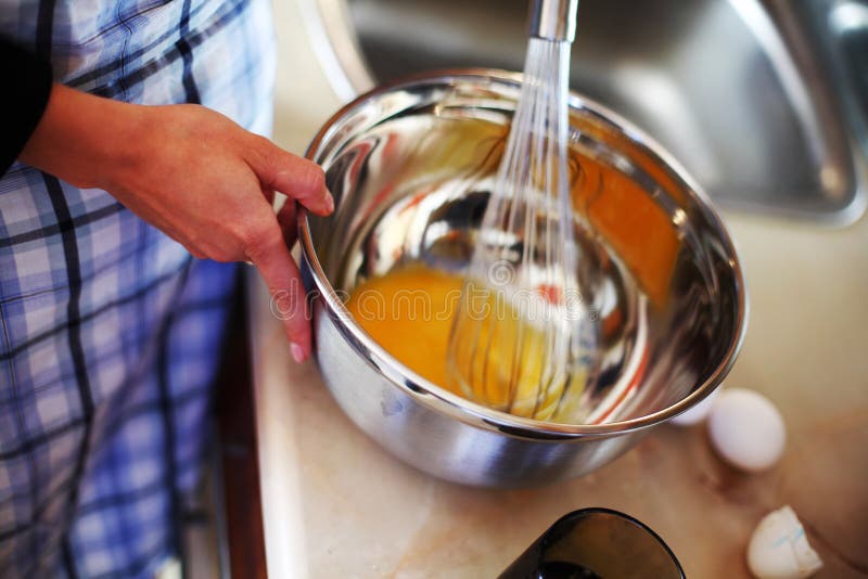 Hand mix egg stock image Hand mix egg stock image