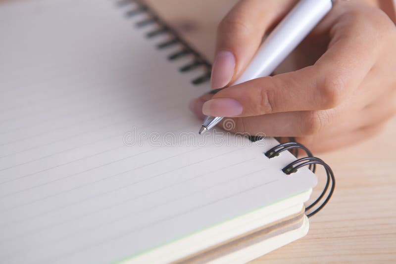 Hand notebook pen writing close-up stock photos