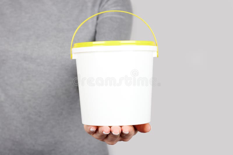 Hand with Paint Bucket on Grey Background Stock Photo Image of pail