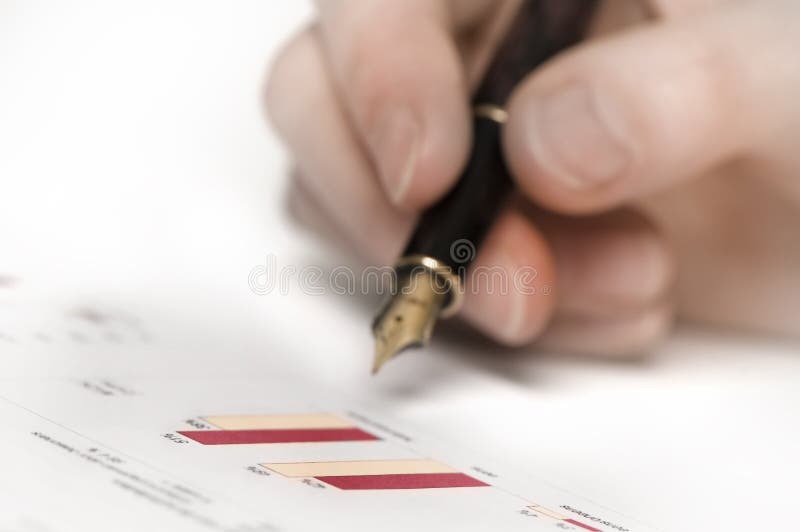 Hand with pen and graphics