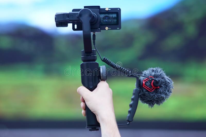Hand of the Person Filming the Event on the Video Camera with a Stabilizer Stock Image Image