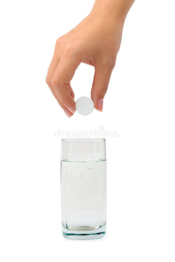Hand with pill and water glass