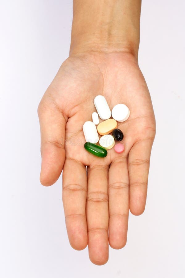 Hand with pills stock photo. Image of pharmaceutical 20041188