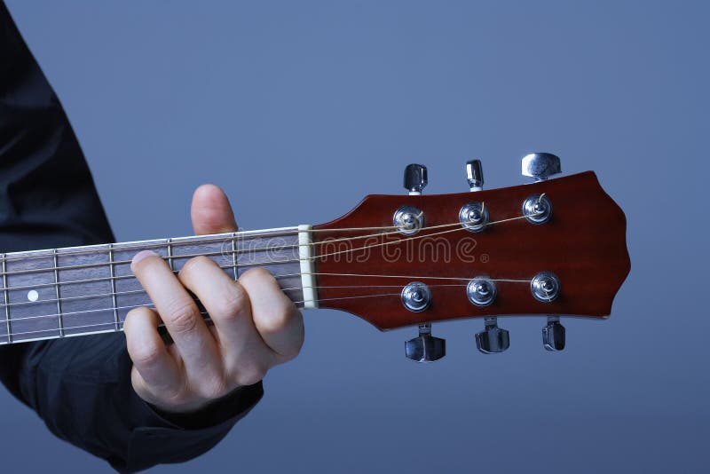 Hand Playing On Neck Of Guitar