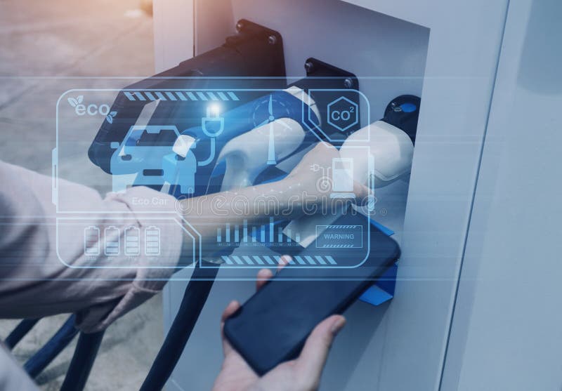 Hand Plugging in a Charger in an Electric Car Socket.Electric Car or Ev