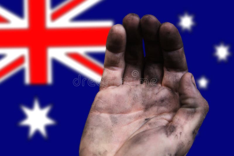 Hand of a Poor Man Against the Background of the Flag of Australia