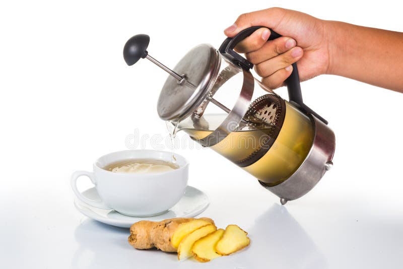 Hand Pouring Ginger Tea into Cup from Filter Jar Stock Photo Image of