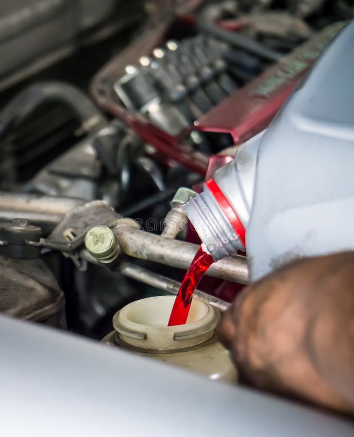 Hand pouring transmission fluid stock photos Hand pouring transmission fluid stock photos