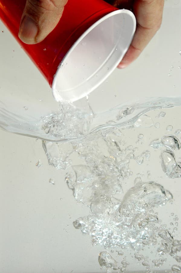 Hand pouring water stock photography