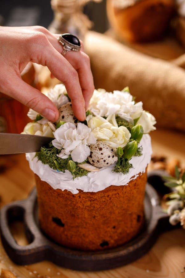 Hand is preparing to cut Easter cupcake. Easter celebration concept. Close-up stock photo Hand is preparing to cut Easter cupcake. Easter celebration concept. Close-up stock photo