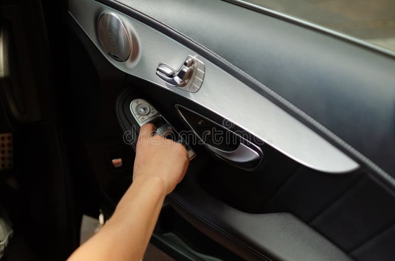 Hand press on car automatic windows control