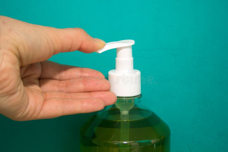Hand presses on the dispenser for liquid soap royalty free stock image Hand presses on the dispenser for liquid soap royalty free stock image