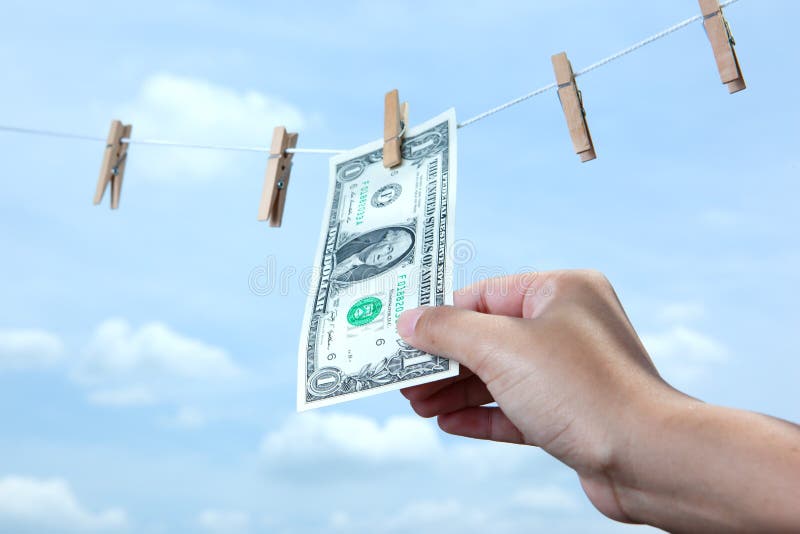 Hand pull money from clothes line