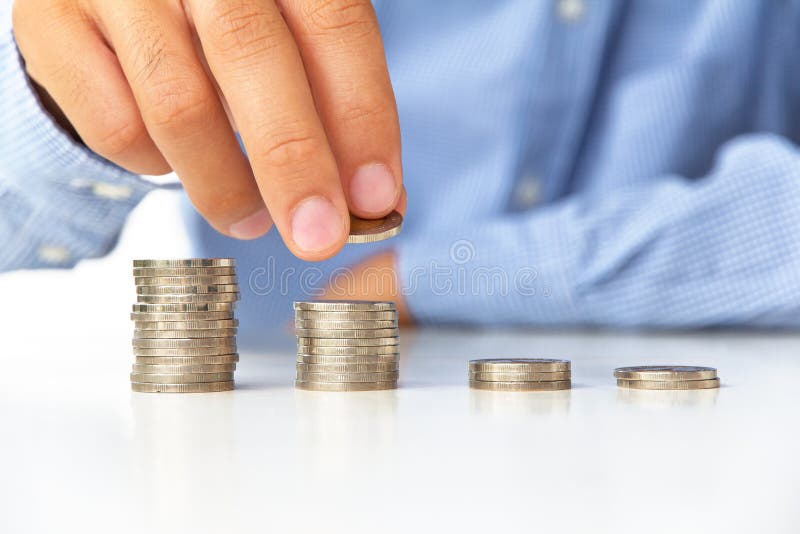 Hand put coin to stack