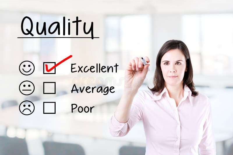 Hand putting check mark with red marker on excellent quality evaluation form. Office background. royalty free stock images