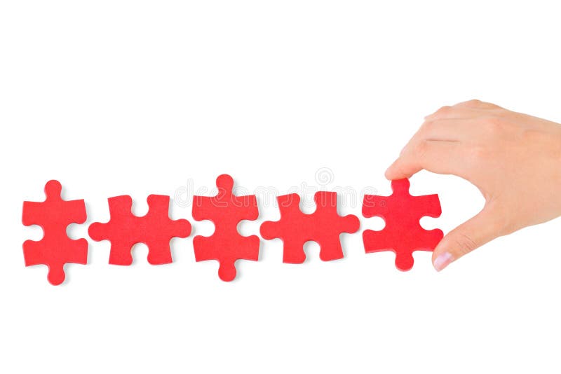 Hand and puzzle stock image