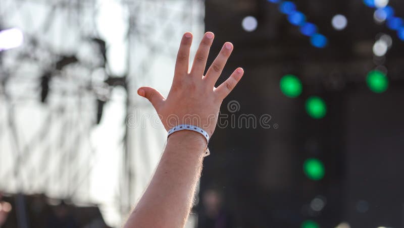 Hand raised up at a man at a concert stock photo Hand raised up at a man at a concert stock photo