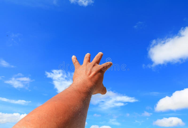 Hand reach out so it the on blue sky background royalty free stock images