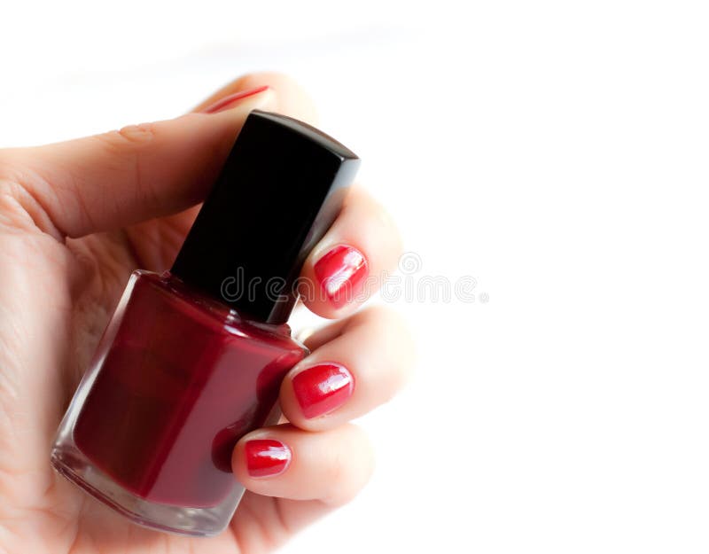 Hand with red nail polish royalty free stock image