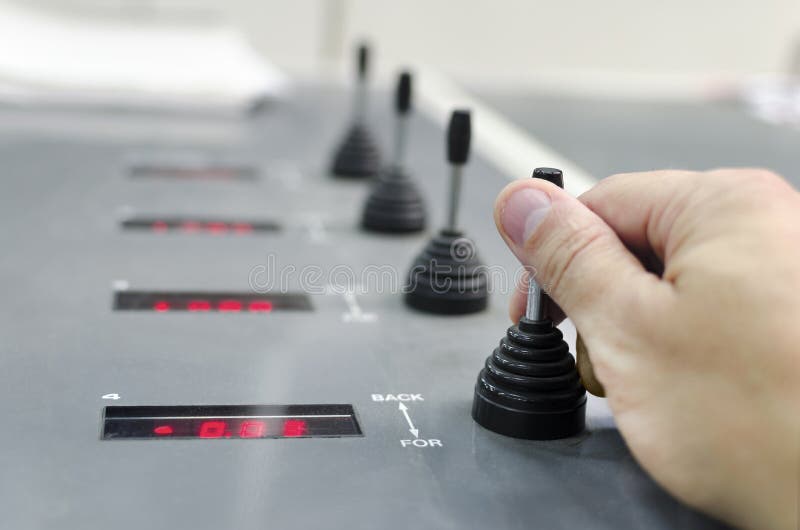 Hand on registration unit on large offset printing machine stock images