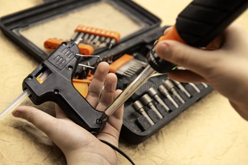 Hand Repairs Glue Gun Using Tool Stock Image Image of hold, black