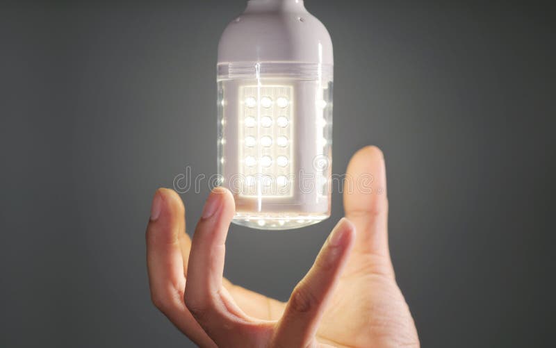 Hand replacing led light bulb