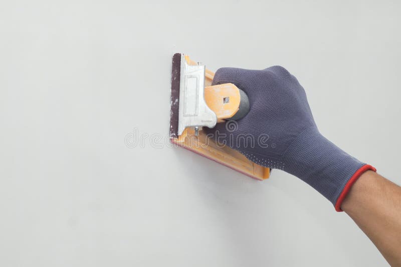 Hand with sandpaper stock image. Image of plaster, repairman 94294683