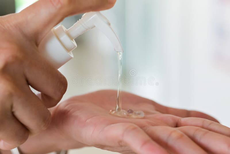 Hand sanitizer,Close up Woman hands using wash hand sanitizer gel dispenser prevention coronavirus