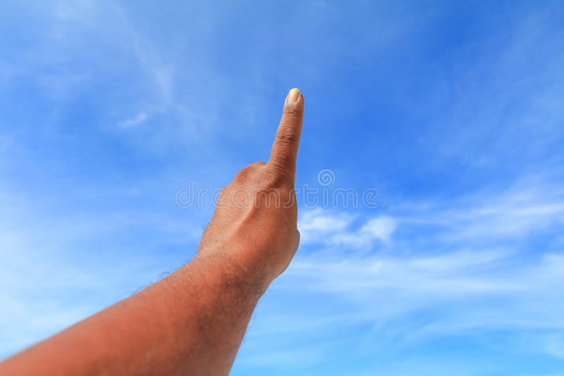 Hand show counting number one on sky background royalty free stock photos