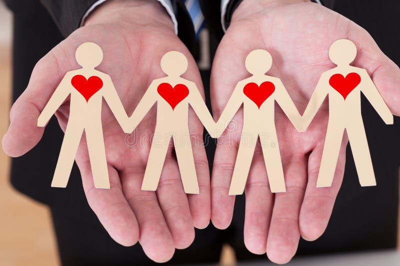 Hand Showing Paper Cut Out Figures royalty free stock photos Hand Showing Paper Cut Out Figures royalty free stock photos