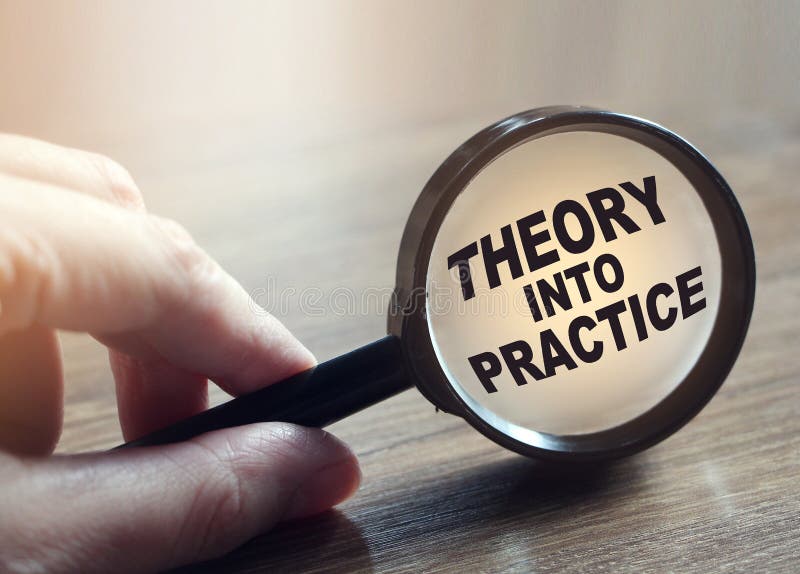 Hand Showing Theory into Practice Words Through Magnifying Glass. Business training concept stock photos