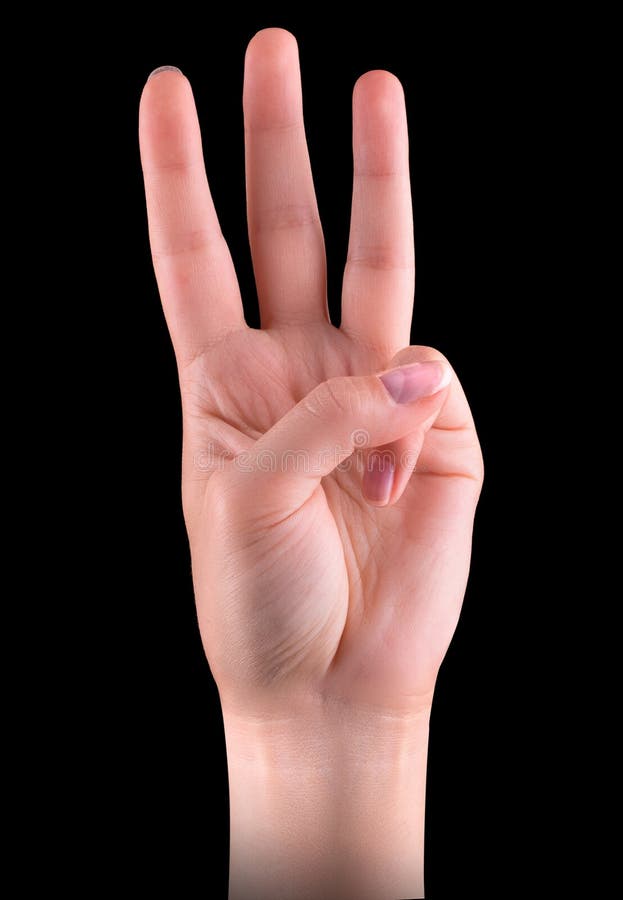 Male hand is showing three fingers isolated on black background.