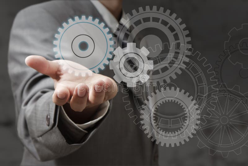 Hand shows cogwheels stock image