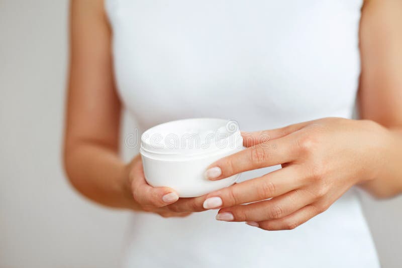 Hand Skin Care. Close Up Of Female Hands Holding Cream Tube, Beautiful Woman Hands With Natural Manicure Nails