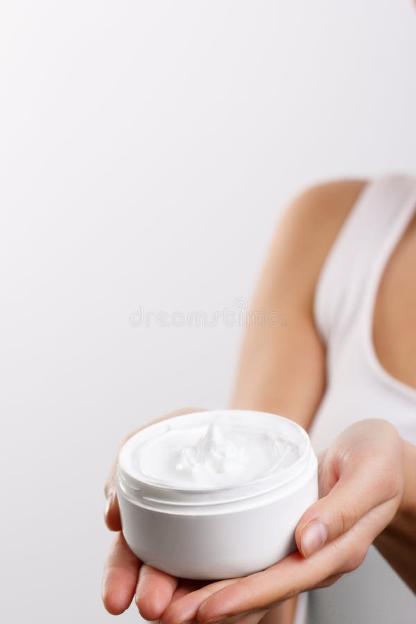 Hand Skin Care. Close Up Of Female Hands Holding Cream Tube, Woman Hands Applying Cosmetic Hand Cream On Soft Silky Healthy Skin.