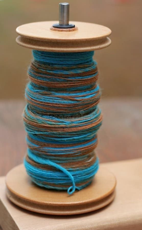 Hand spun yarn on bobbin