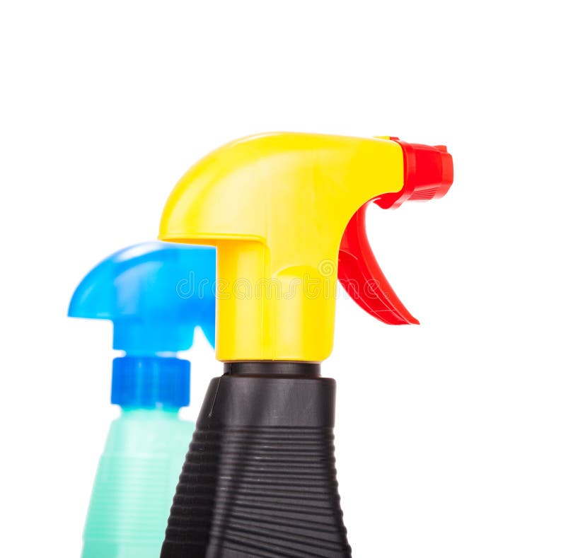 Hand squirting a bottle of cleaning spray