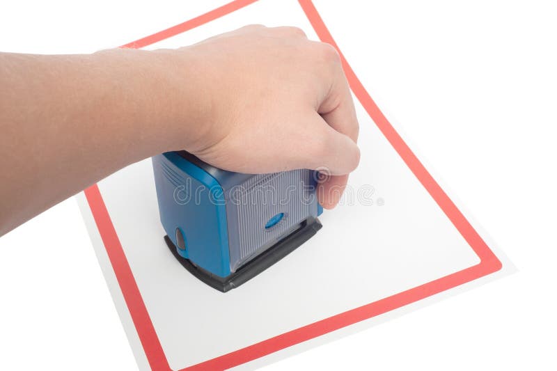 Hand with stamp for documents and paper stock photos